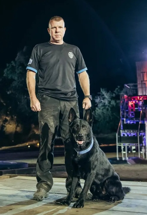 Aaron Peterman with police K-9